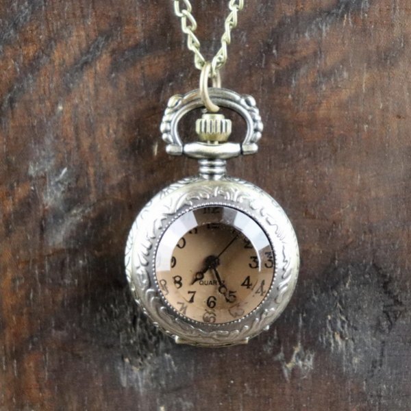 Small pocket watch with tinted glass lid
